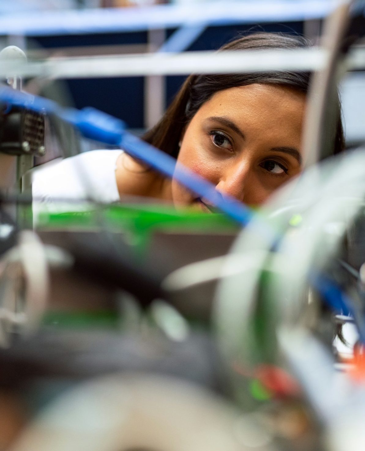 woman looking through machine