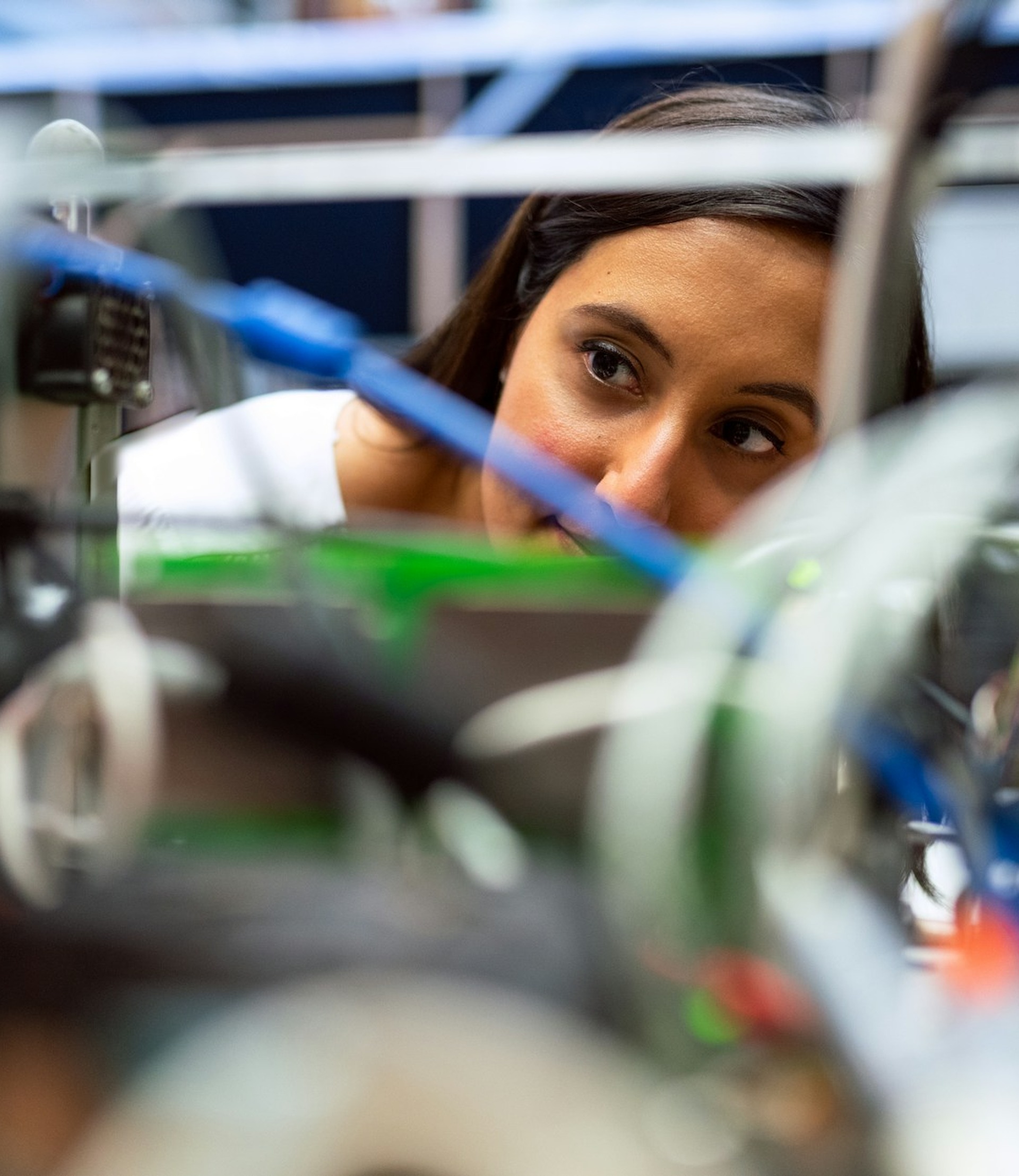 woman looking through machine